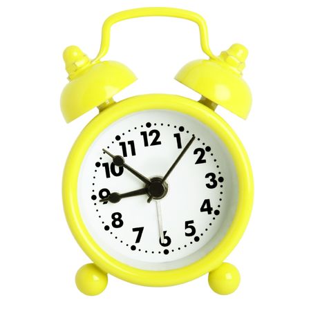 Yellow alarm clock with bells isolated on white の写真素材