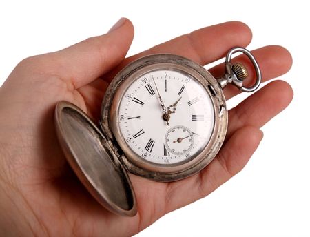 Hand shows antique pocket watch, isolated on whiteの写真素材
