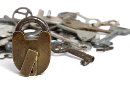 Old padlock and heap of keys isolated on white

の写真素材
