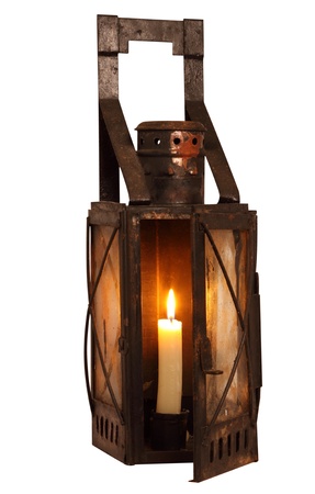 Old lamp with burning candle, isolated on white backgroundの写真素材