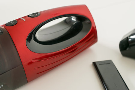 Close-up view of a red car vacuum cleanerの写真素材