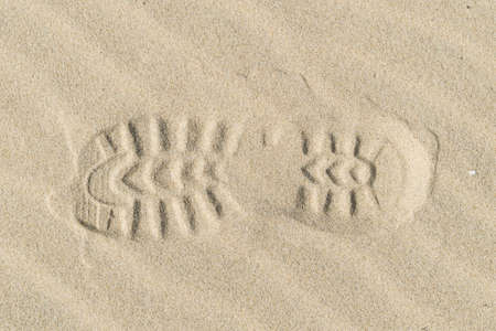 View of a shoe footprint in the sandの写真素材