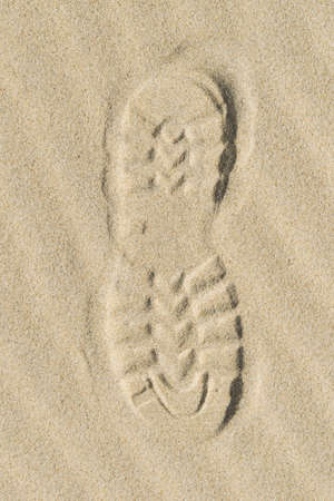 View of a shoe footprint in the sandの写真素材