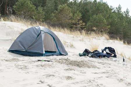 View of a tent on the sandy beach of the Baltic Sea