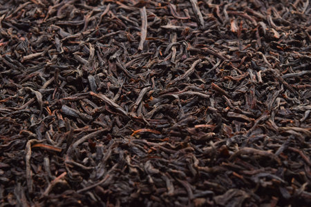black tea background. dried black tea. English Breakfast Tea ingredients. Ceylon Black Tea close up. top viewの写真素材
