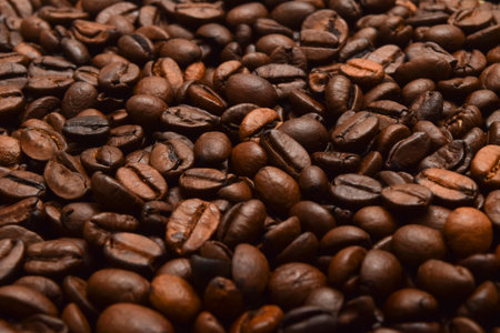 Dark roast coffee beans background, top view.の写真素材