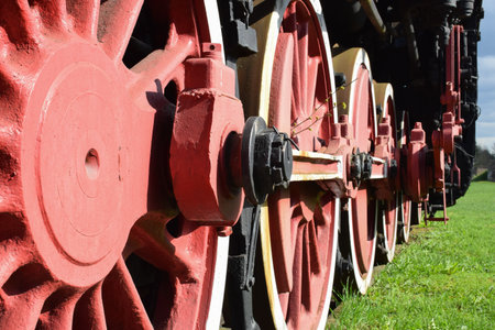 wheels of an old steam locomotive standing on rail