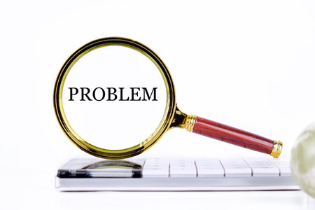 PROBLEM lettering through a magnifying glass on a calculator and part of a magic ball in the...