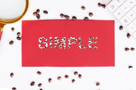 SIMPLE word, text on a red cardboard