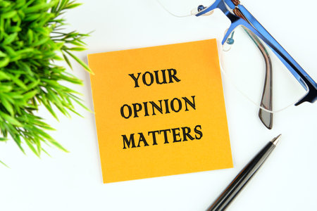 YOUR OPINION MATTERS phrase written on an orange sticker on a white backgroundの写真素材