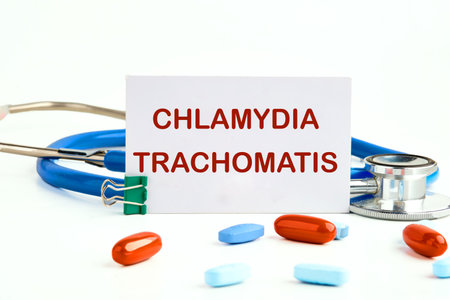 Chlamydia trachomatis on a white business card on a white background next to a stethoscope and...