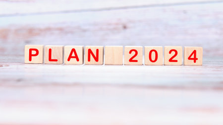 PLAN 2024 on wooden cubes on a light backgroundの写真素材