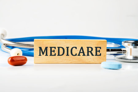 Medical concept. MEDICARE word on a wooden block on a gray backgroundの写真素材