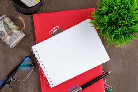 An open notebook for writing on the red business book for writing. A place to copy. Concept photo