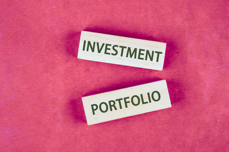 Copy space. INVESTMENT PORTFOLIO symbol. Concept words. Business INVESTMENT PORTFOLIO concept on blocks made of wood, top view Conceptual photoの写真素材