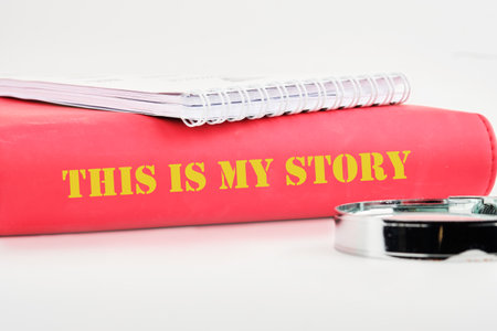 Business and my story concept. Text This is my story on the back of the book cover, a notebook on a...