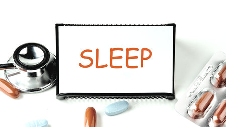 Sleep deep symbol. Word SLEEP written on a white business card on a stand on a white background.