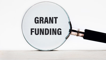 Business and grant funding concept. Copy space. Words GRANT FUNDING text appeared looking at a white...