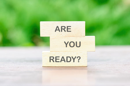 Business and Are you ready concept. Question words ARE YOU READY on wooden bars on a table on a...