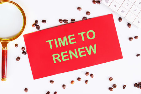 Conceptual time to renew symbol. Copy space. Time to renew words written on a red card on a white...