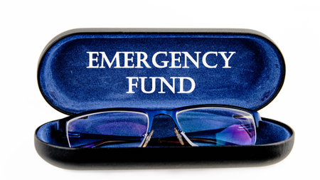 Text concept. words EMERGENCY FUND symbol on the inside of the glasses case on a white background