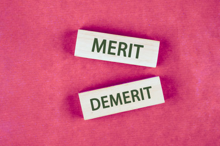 Business and demerit or merit concept. Copy space. Concept word Demerit or Merit on blocks made of...