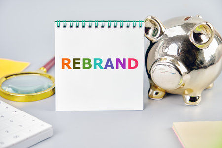 Rebrand and Business concept. Copy space. Rebrand symbol on a blank sheet in a notebook in a...