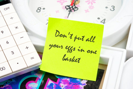 Concept Image. Do not put all your eggs in one basket Message inscription on a yellow sticker on the...