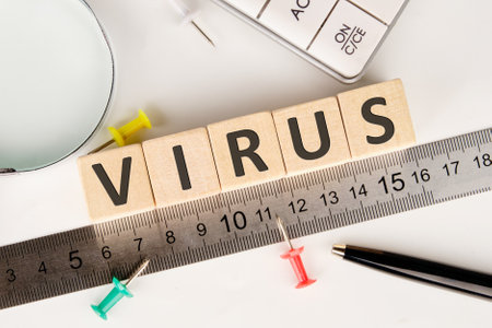 VIRUS word alphabet letters on wooden cubes laid out along the measuring ruler
