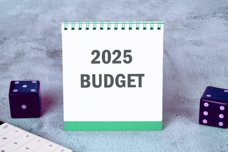 Conceptual budget 2025 symbol. Copy space. Budget 2025 words written on a notebook on a gray backgroundの写真素材