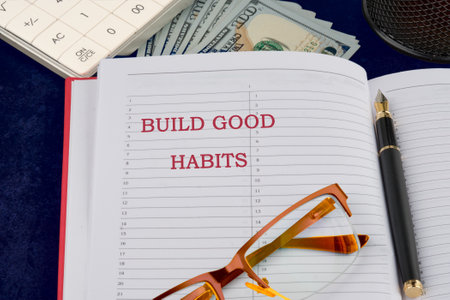 Healthy lifestyle and Healthy habits concept. Copy space. BUILD GOOD HABITS words strategic inscription, explanation, conceptual idea in a composition with motivating elements of banknotesの写真素材