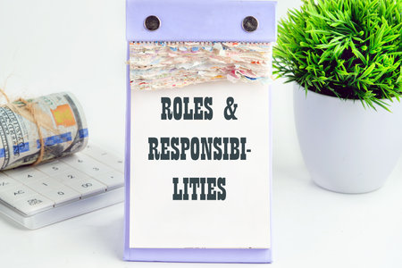 ROLES and RESPONSIBILITIES text written a conceptual phrase on a desktop tear-off calendar