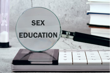 Sex education concept. SEX EDUCATION written on the background through a magnifying glaの写真素材