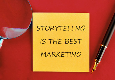 Copy space. Conceptual symbol STORYTELLING IS THE BEST MARKETING on a yellow sticker on a red saturated backgroundの写真素材