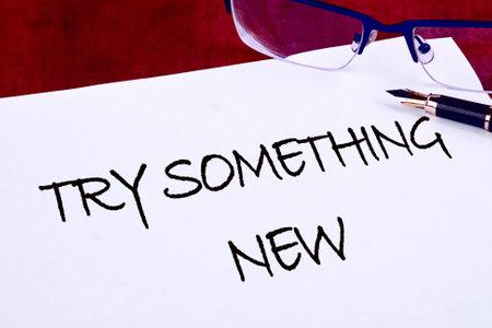 Business, time for something new concept. TRY SOMETHING NEW on a blank sheet there is an inscription with a fountain penの写真素材