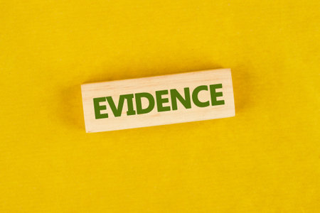 Criminal investigation and investigation Fingerprint. Evidence in criminal investigations. The conceptual phrase EVIDENCE made up of wooden blocksの写真素材