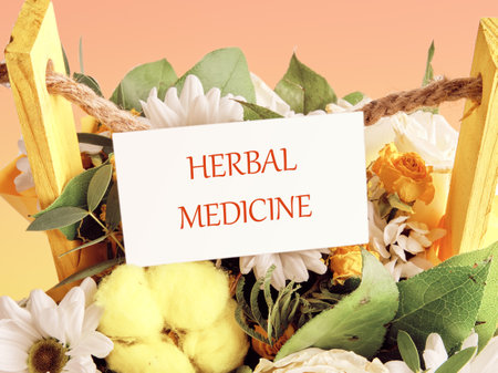 HERBAL MEDICINE words written on a white business card against a background of bouquets of flowersの写真素材