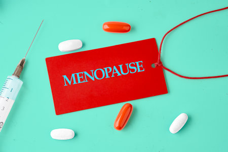 Menopause creative concept. Menopause word letters text on the red card, the concept of health and lifestyleの写真素材