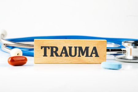 TRAUMA written on a wooden block. Front viewの写真素材