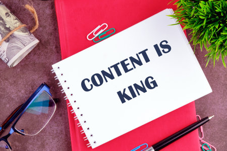 Business and Content is king concept. Copy space. CONTENT IS KING there is a note in the notebook for actionsの写真素材
