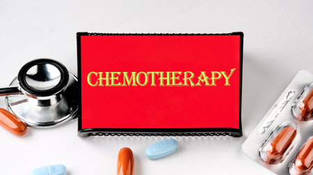 Chemotherapy creative concept. CHEMOTHERAPY word letters text on a red business card with yellow textの写真素材
