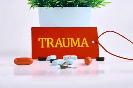 TRAUMA written on a red card, on a light background. The concept of health and medicineの写真素材