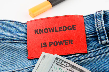 KNOWLEDGE IS POWER words on the jeans tag