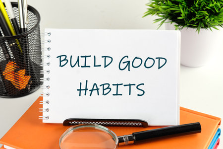 Business, psychological and build good habits concept. BUILD GOOD HABITS handwritten text in a notebook, notepadの写真素材
