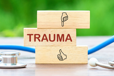 TRAUMA written a conceptual phrase on wooden blocksの写真素材