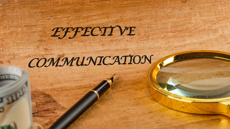 Info concept. EFFECTIVE COMMUNICATION words on papyrus in a composition with a fountain pen, a magnifying glass and American dollarsの写真素材
