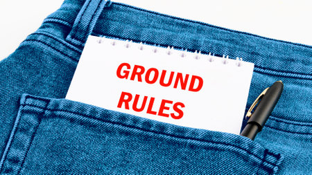 Conceptual ground rules symbol. Copy space. GROUND RULES words written on a notebook in red letters in jeansの写真素材