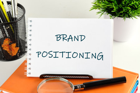 Economic concept. The inscription BRAND POSITIONING handwritten text in a notebook, notepadの写真素材