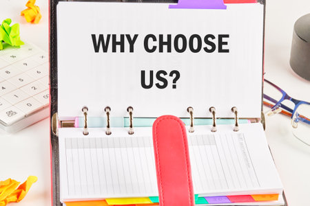 Word writing text Why Choose Us Question. Business concept. WHY CHOOSE US in a business notebook on a free page from entriesの写真素材