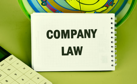 Business, accounting and real estate concept. COMPANY LAW written in the notebook, the front viewの写真素材